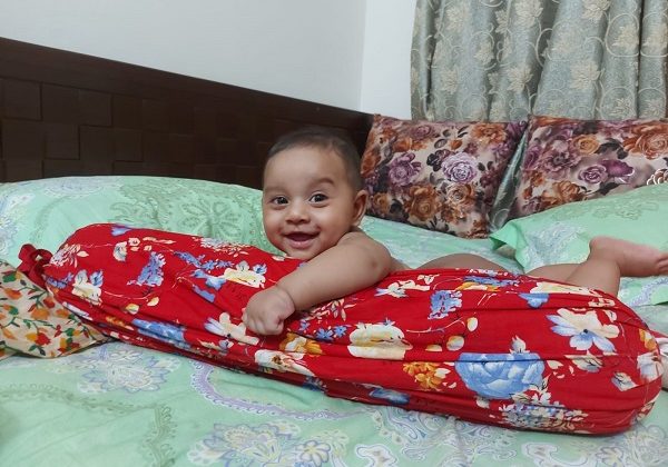 শিশুর হাসিমাখা মুখ। মডেল-আরিজ